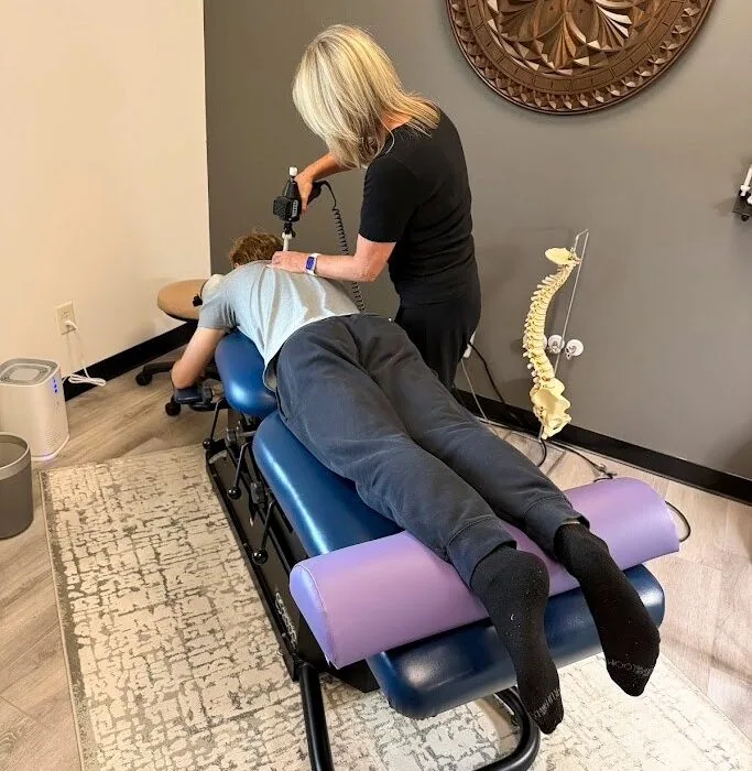Dr. Shona adjusting a patient with the ArthroStim